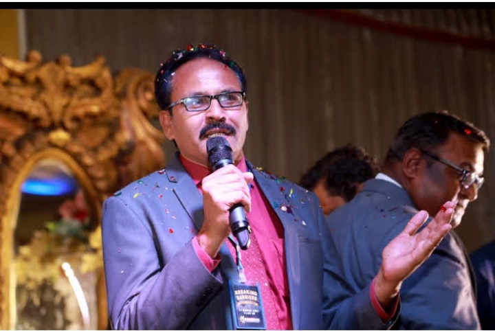 Bishop Iqbal Danish receiving certificate in Christian Leadership and Management from International Kingdom University USA